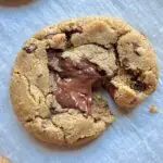 cookie split partially in half on parchment paper