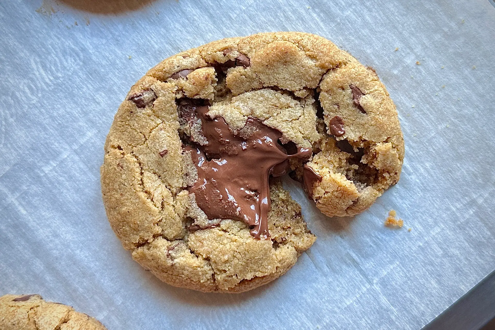 cookie split partially in half on parchment paper