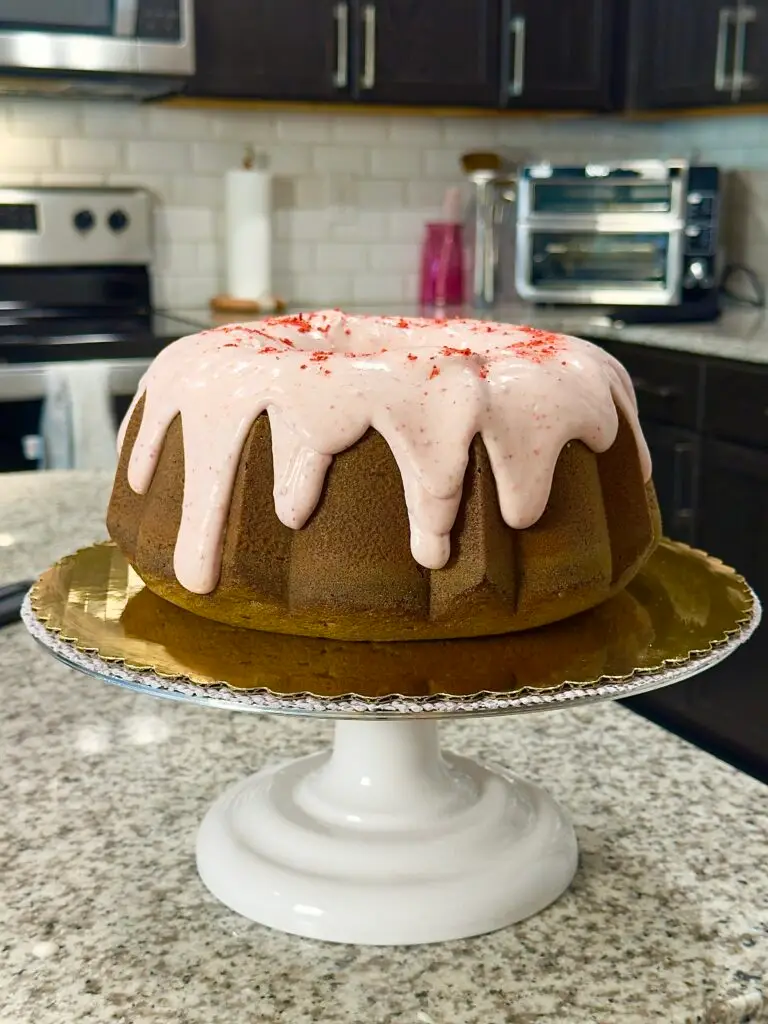 frosted cake on a cake stand