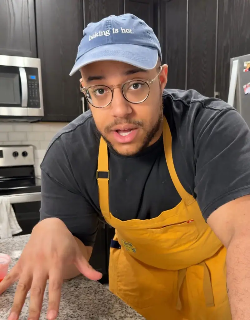 person in a kitchen talking to camera